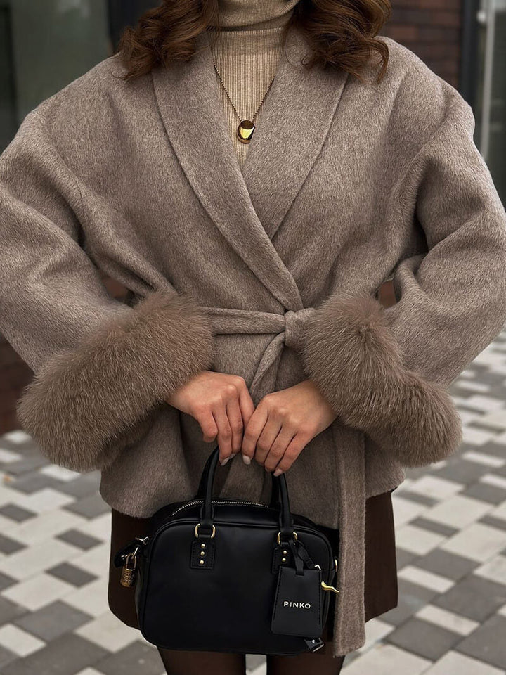 Women's belted wrap coat, elegant design with luxurious faux fur cuffs. Perfect winter outerwear.
