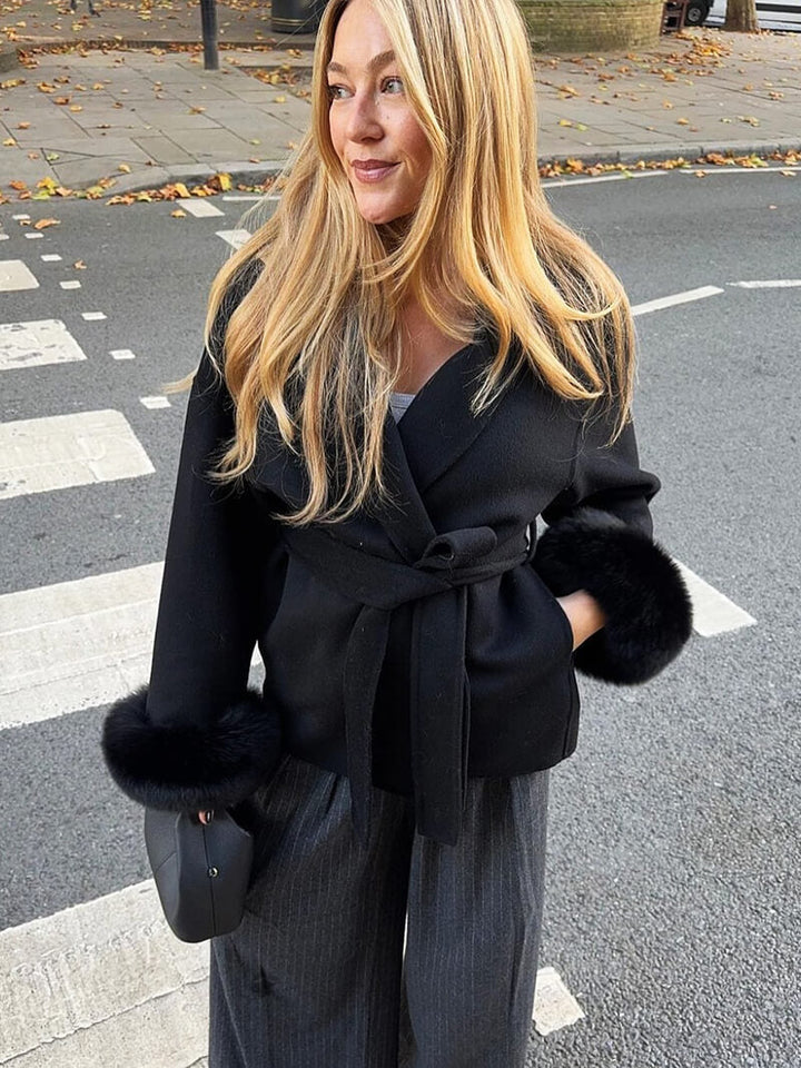 Premium women's belted wrap coat, designed with a shawl collar & luxurious faux fur cuffs.