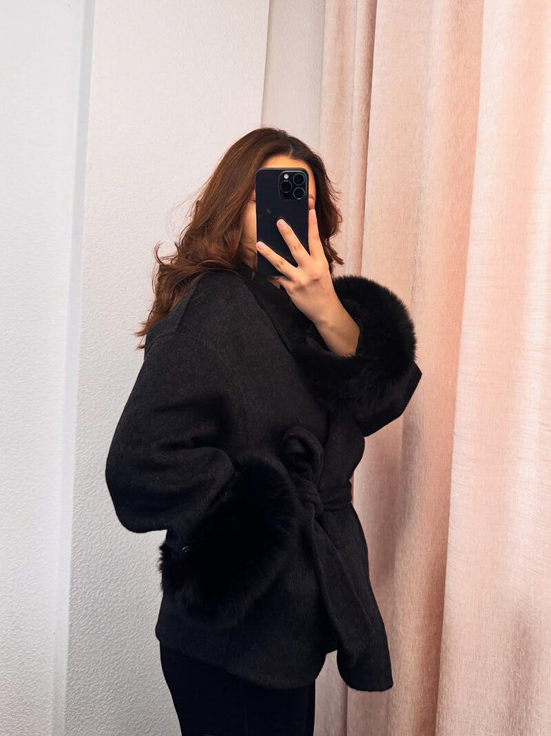 Elegant women's winter outerwear: belted wrap coat with beautiful faux fur cuffs.