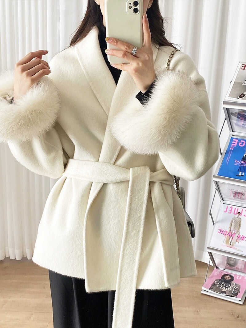 Warm women's winter coat with a sophisticated shawl collar and elegant faux fur trimmed cuffs.