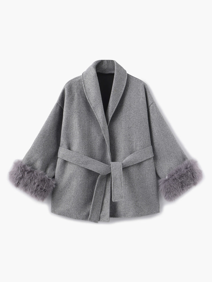 Luxury women's belted coat, ideal for cold weather, detailed with soft faux fur cuffs.