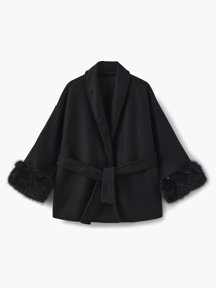 Fashionable women's wrap coat, featuring a sophisticated shawl collar and chic faux fur cuffs.