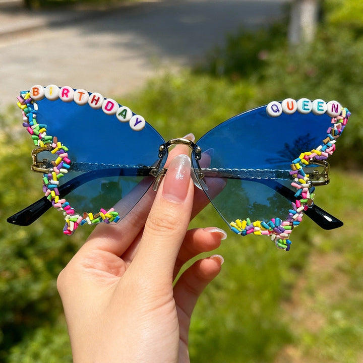 Women's 'Birthday Queen' butterfly frame sunglasses. Colorful, whimsical, UV protected eyewear.