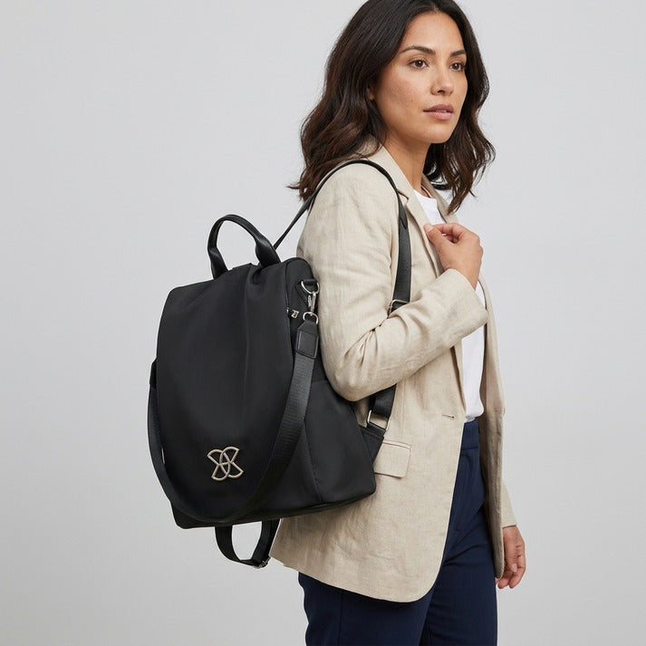 Everyday carry women's anti-theft crossbody bag. Secure & stylish shoulder bag for daily essentials. Beige.
