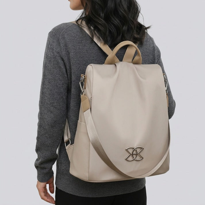 Sleek brown women's anti-theft crossbody bag, a secure & organized shoulder bag for modern commuters.