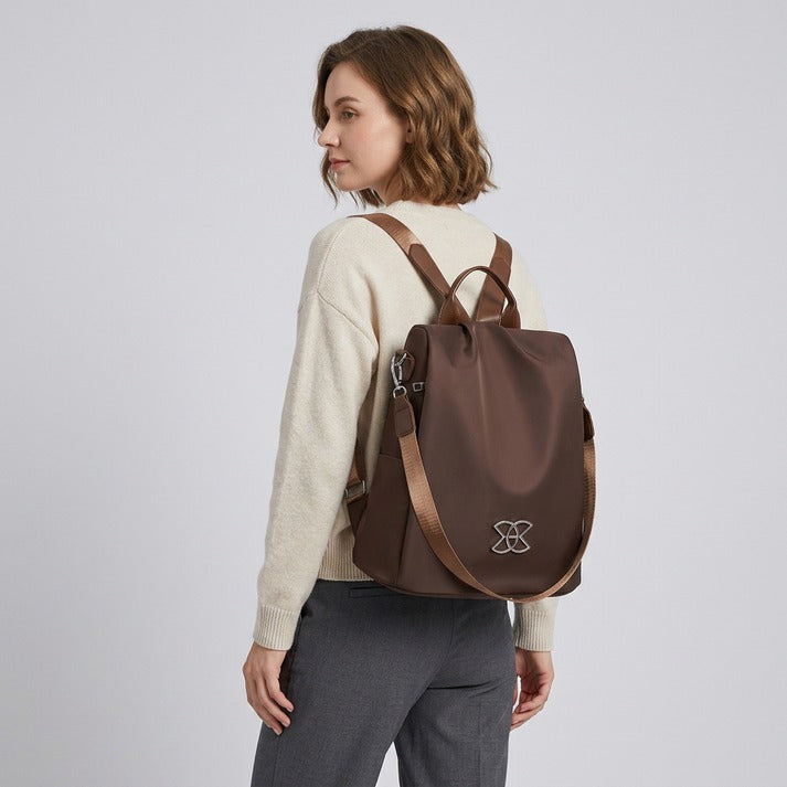 Versatile anti-theft women's crossbody bag. Secure, stylish & organized for travel, commuting, or daily errands. Beige.