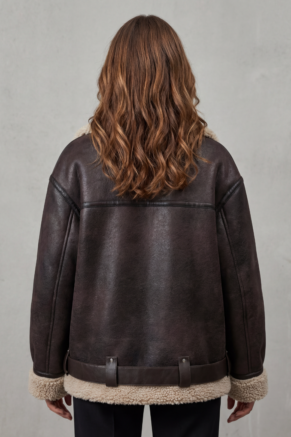 Classic black women's aviator jacket with a stylish belt, ideal for trendy and warm outerwear during cold seasons.