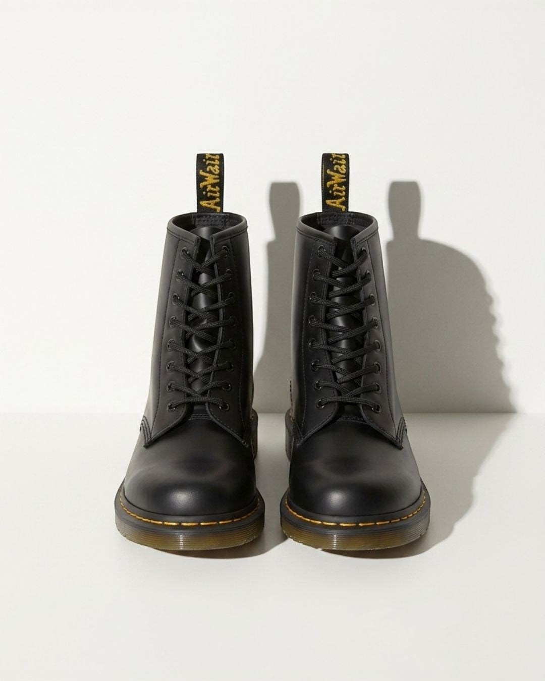 Stylish women's biker combat boots, black lace-up ankle design suitable for urban fashion & edgy looks.