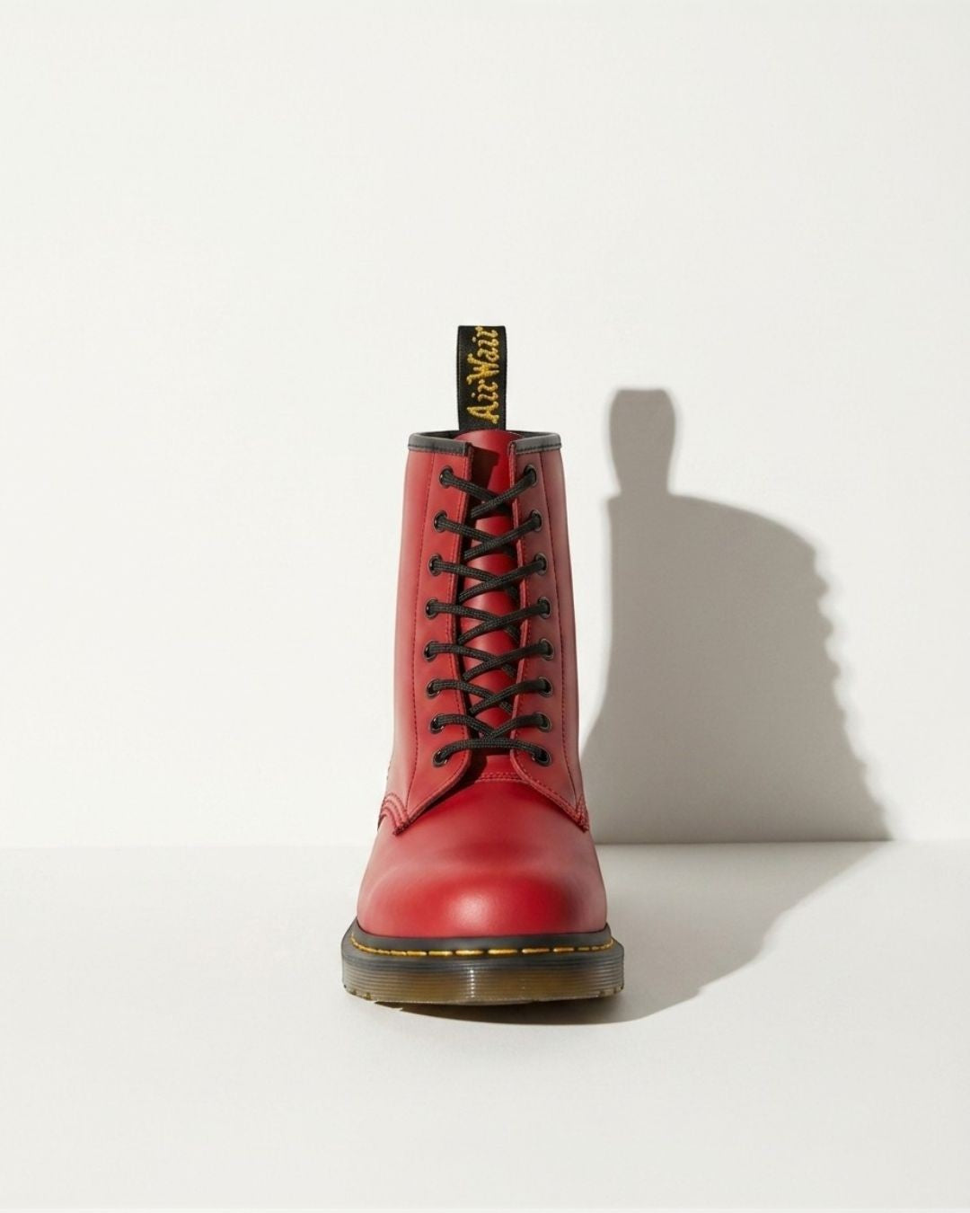 Statement black women's combat boots, lace-up ankle style with chunky sole for bold urban and motorcycle looks.