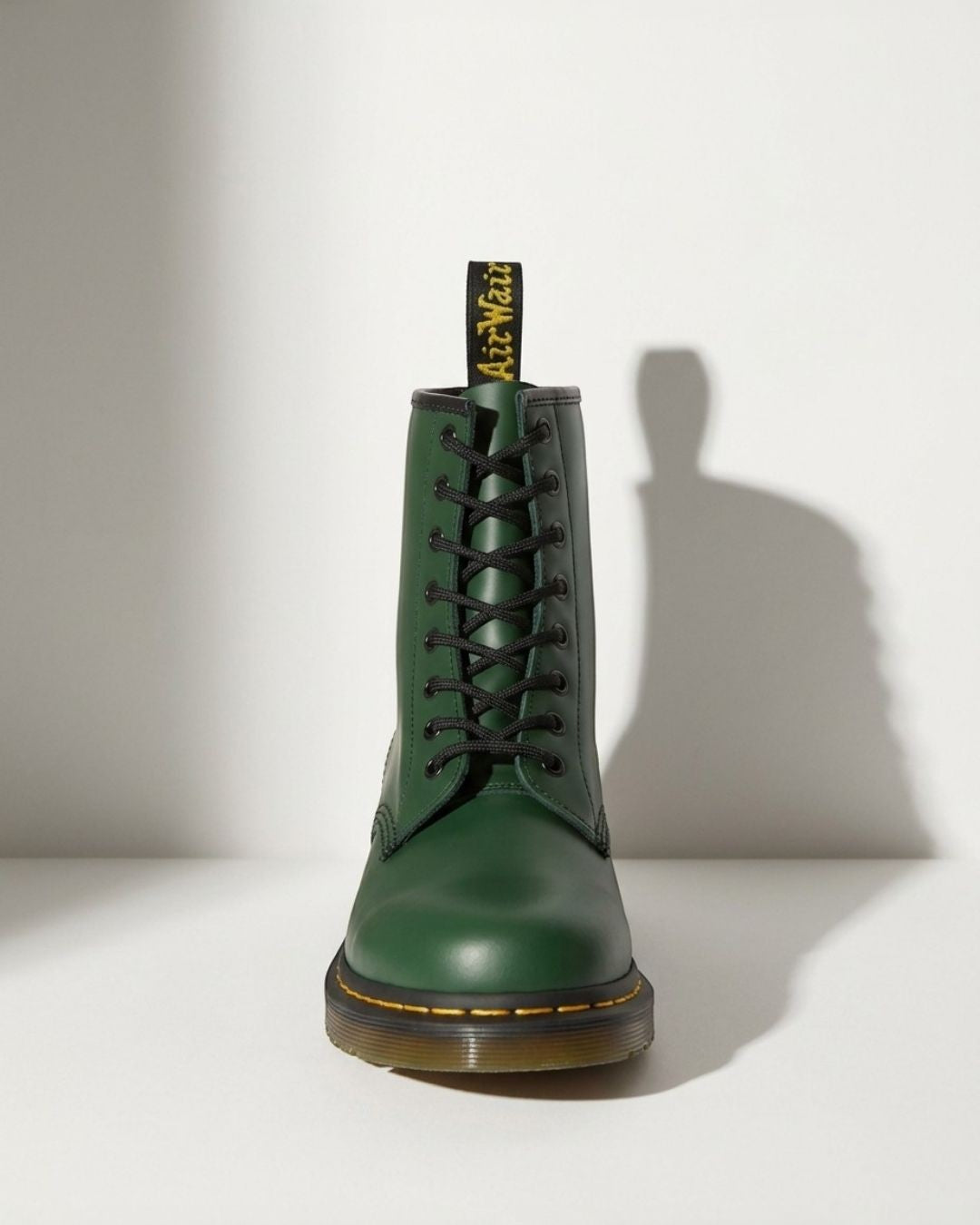 Close-up of women's black lace-up combat ankle boots, showing chunky sole and durable design.