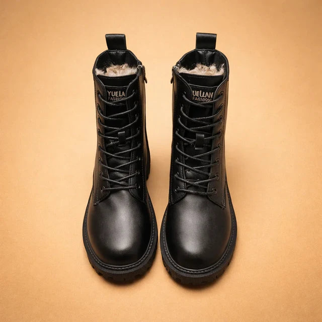 Fashionable women's black combat lace-up ankle boots. Insulated for warmth, perfect for fall & winter outfits.