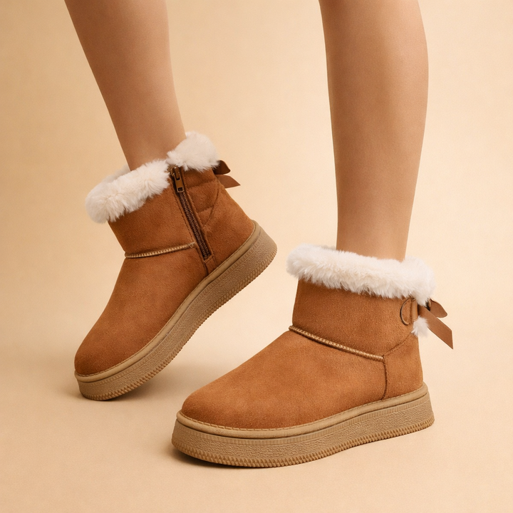 Comfortable women's brown slip-on winter boots, warm ankle style, perfect for cozy fall fashion and everyday wear.