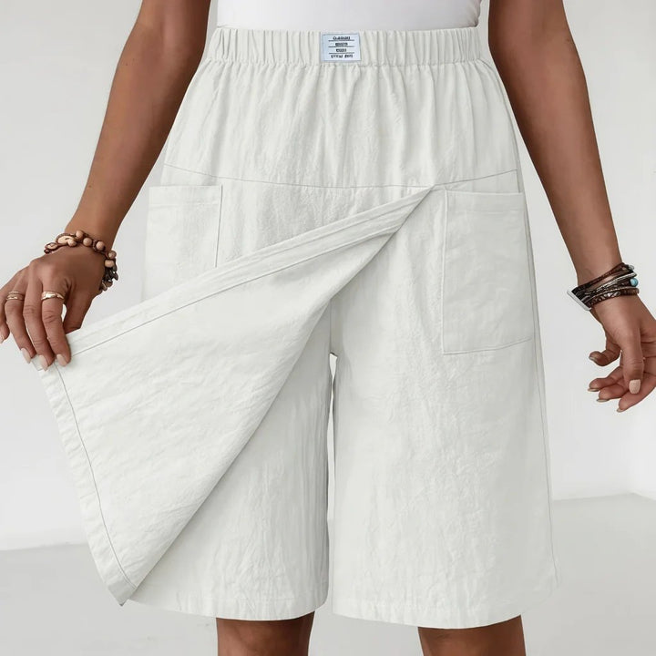 Women's workout shorts featuring an elastic waistband & practical pockets, great for sports, gym, or active days.