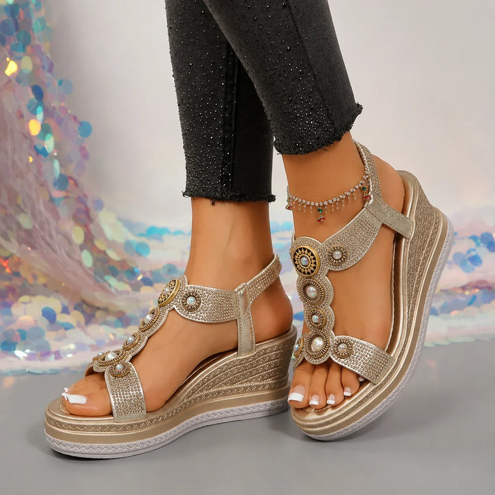Elegant women's embellished platform wedge sandals with T-strap; comfortable heeled summer footwear.