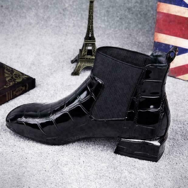 Full view of women's stylish black boots, providing comfort and durability for everyday footwear.