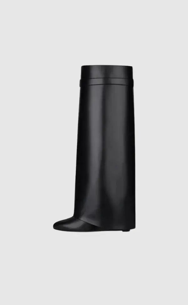 Women's black glossy sculptural wedge knee-high boots, offering avant-garde futuristic style.