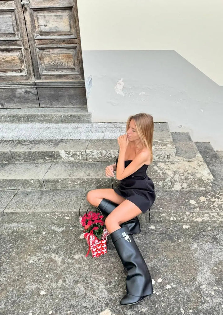 High fashion women's black glossy knee-high boots, sculptural wedge, perfect statement footwear.