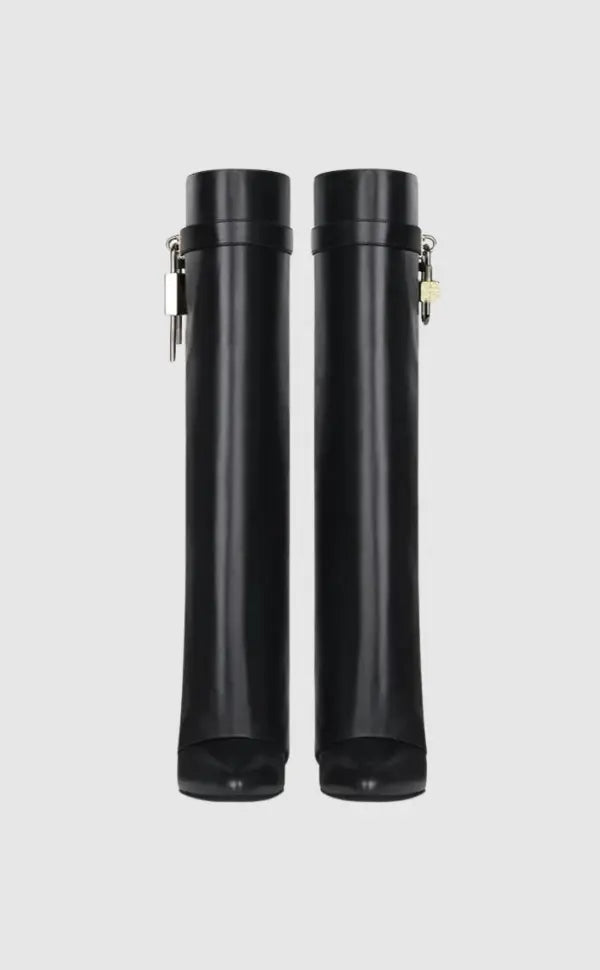 Modern women's sculptural wedge knee-high boots in glossy black, exuding designer-inspired fashion.
