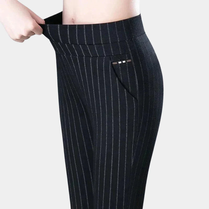 Striped high-waisted stretch trousers for women, offering comfort and style for everyday wear.