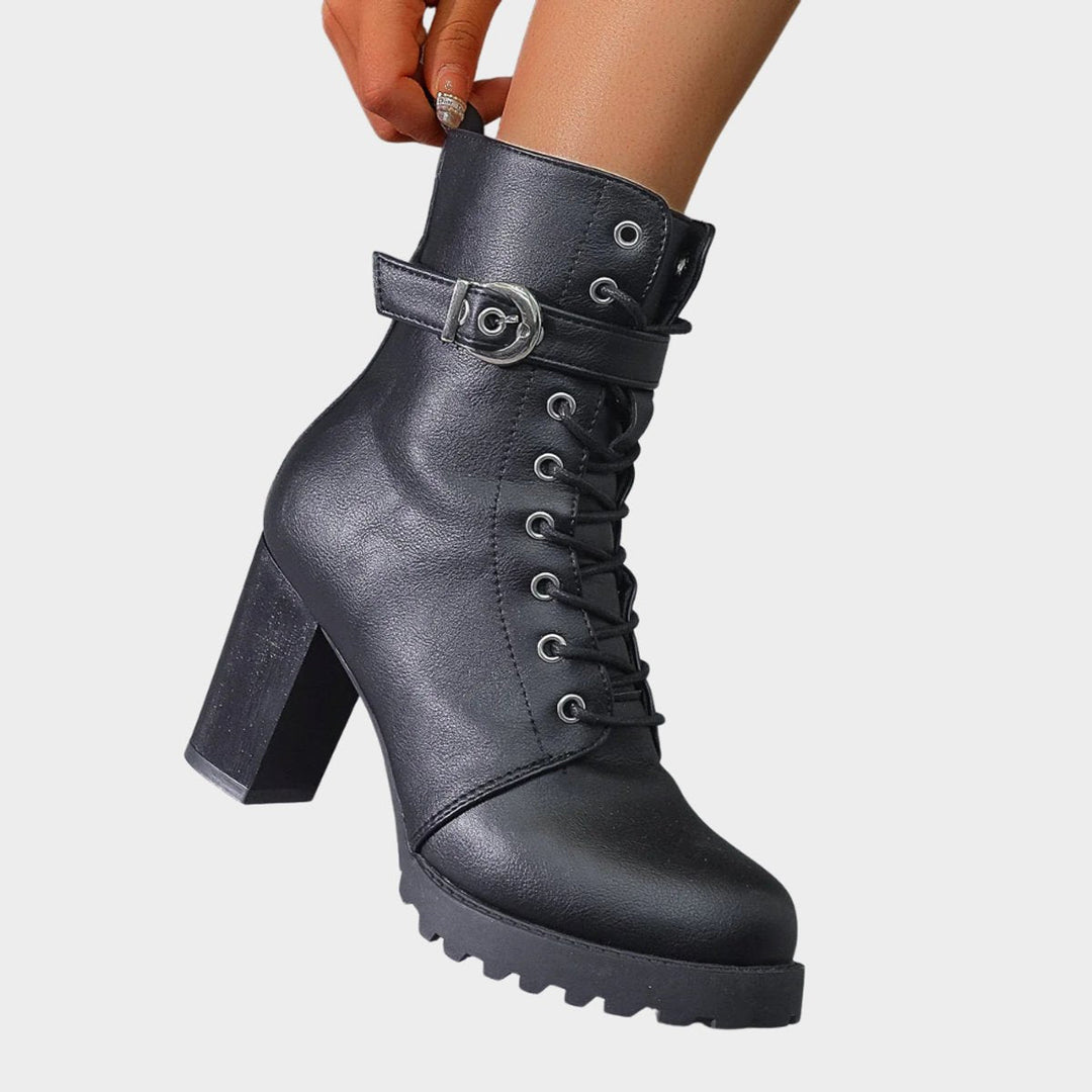 Sturdy black women's lace-up ankle boots. Features comfortable block heel & adjustable buckle for fit.