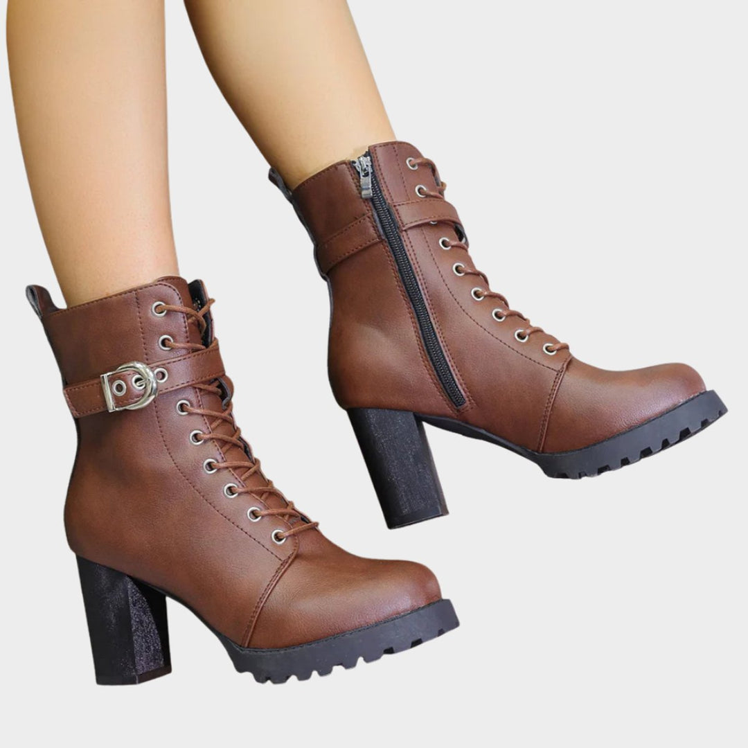 Casual yet chic women's black ankle boots. Lace-up style, sturdy block heel & fashionable buckle straps.