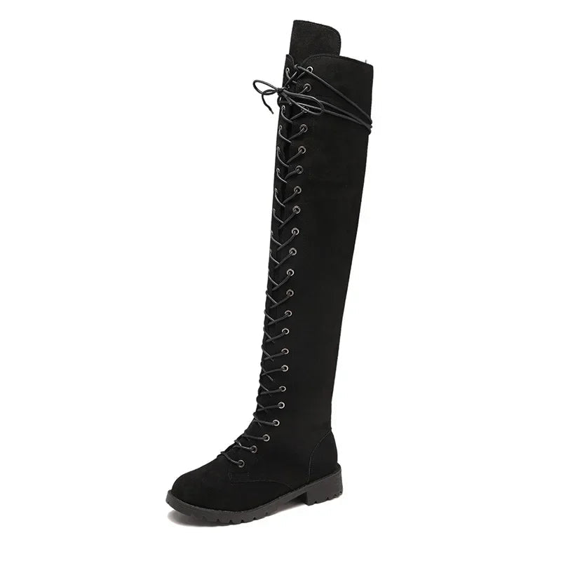 Detailed lace-up front on fashionable women's over-the-knee boots, a key statement for stylish tall footwear.