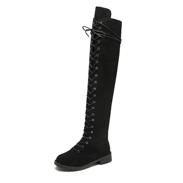 Detailed lace-up front on fashionable women's over-the-knee boots, a key statement for stylish tall footwear.