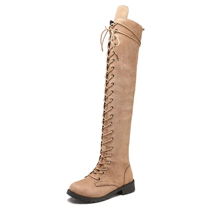 Women's over-the-knee lace-up boots, a confident and stylish footwear choice for fall & winter fashion.