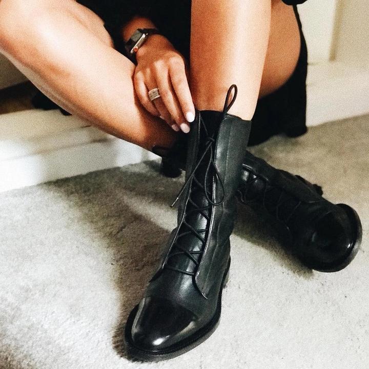 Comfortable and stylish black lace-up ankle boots for women, a fashion essential.