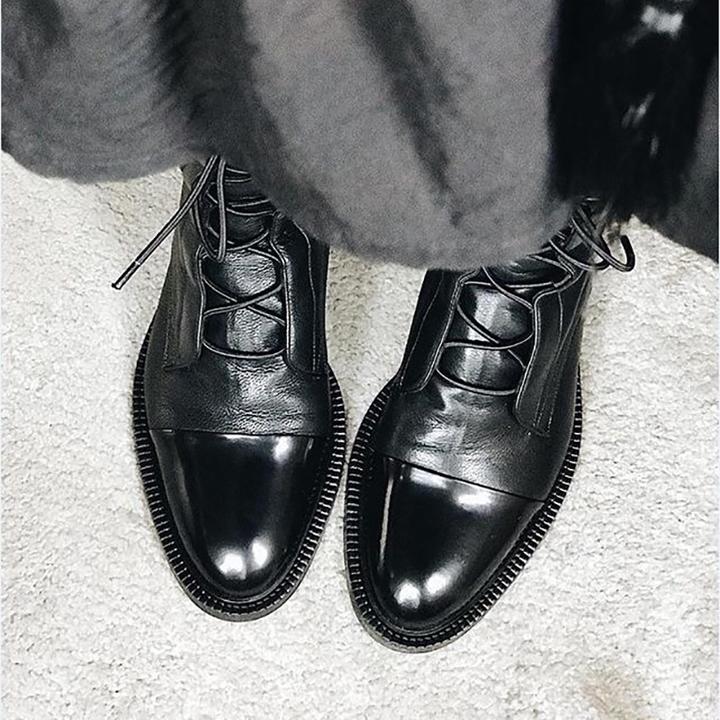 Fashionable women's black lace-up ankle boots, timeless design for smart casual looks.