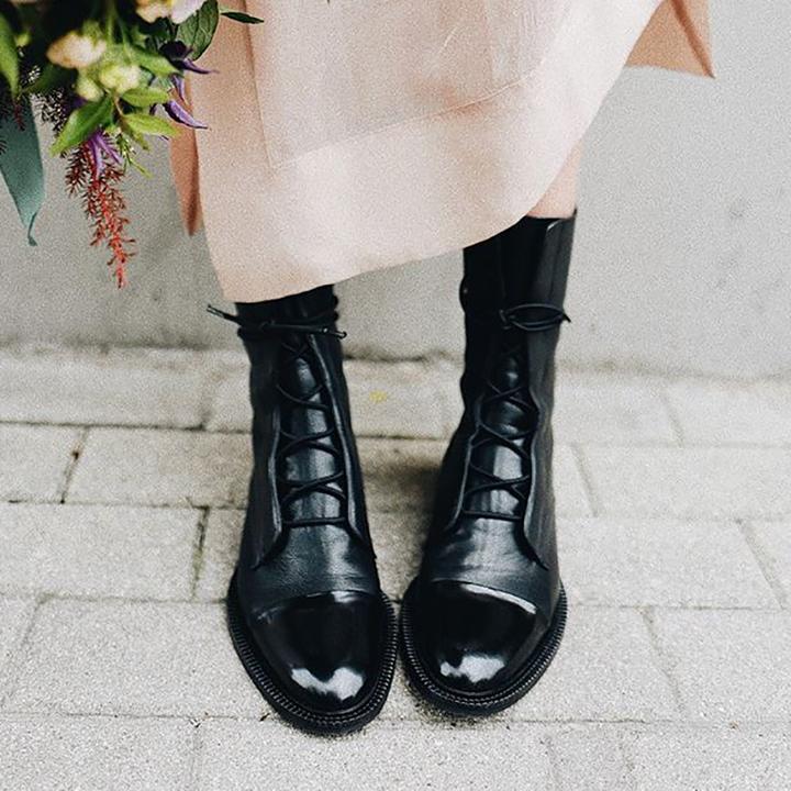 Black women's lace-up ankle boots, a classic and comfortable choice for any outfit.