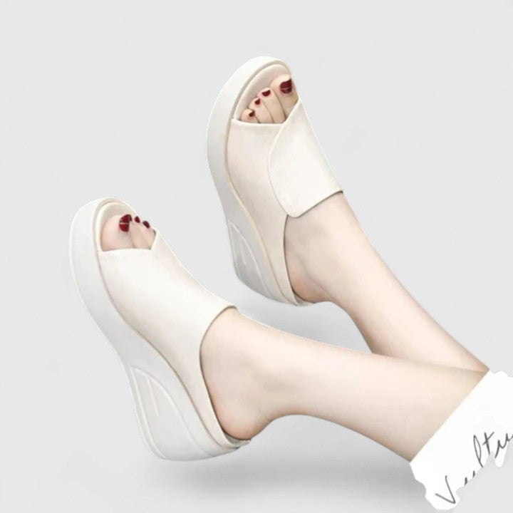 Red ergonomic women's wedge sandals providing all-day foot pain relief, comfortable orthopaedic design with arch support.