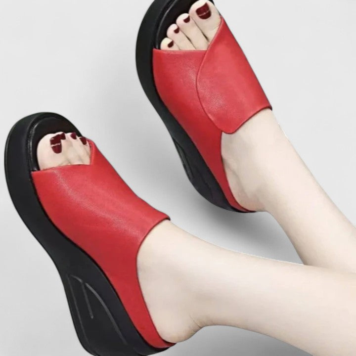 Comfortable women's orthopaedic wedge sandals, available in black, beige & red, offering arch support for pain relief.