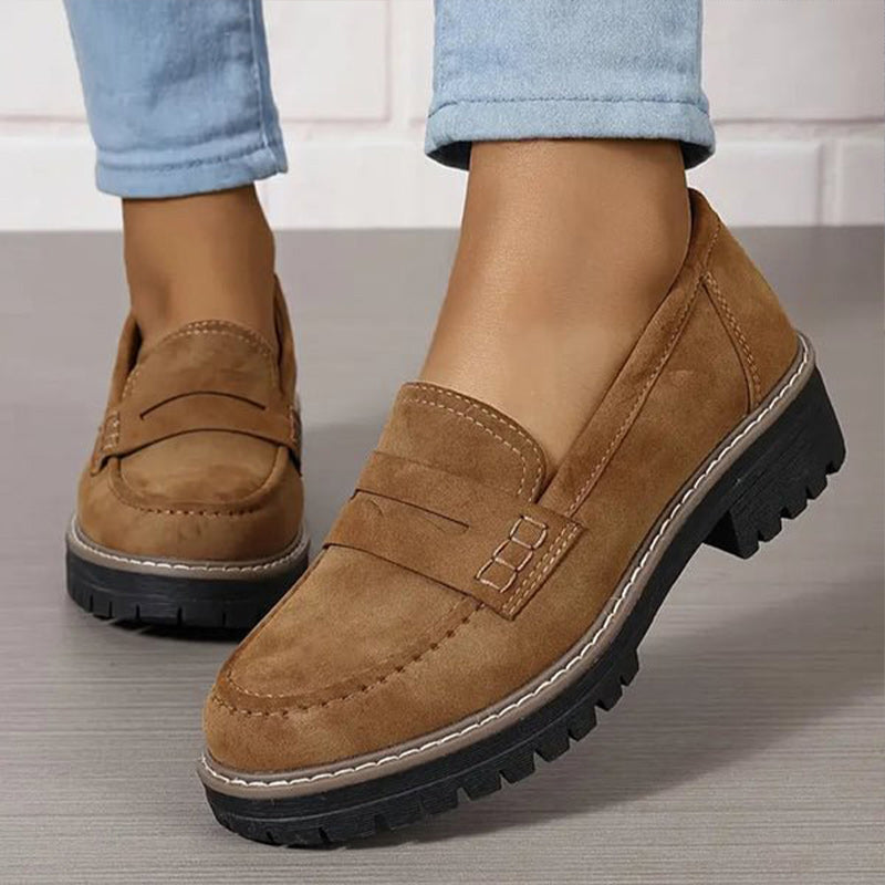 Comfortable women's slip-on platform loafers, featuring a stylish vamp strap & durable chunky sole.
