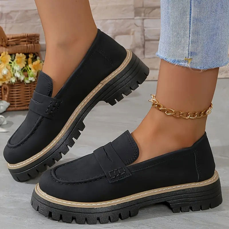 Trendy women's platform loafers with a chic vamp strap, perfect for modern casual or elegant outfits.