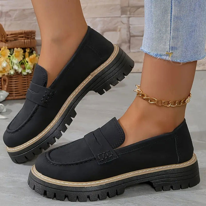 Trendy women's platform loafers with a chic vamp strap, perfect for modern casual or elegant outfits.