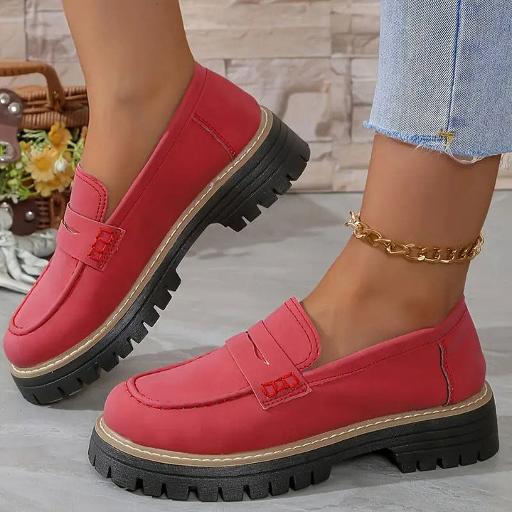 Women's platform loafers with chunky sole, elegant vamp strap, and easy slip-on design.