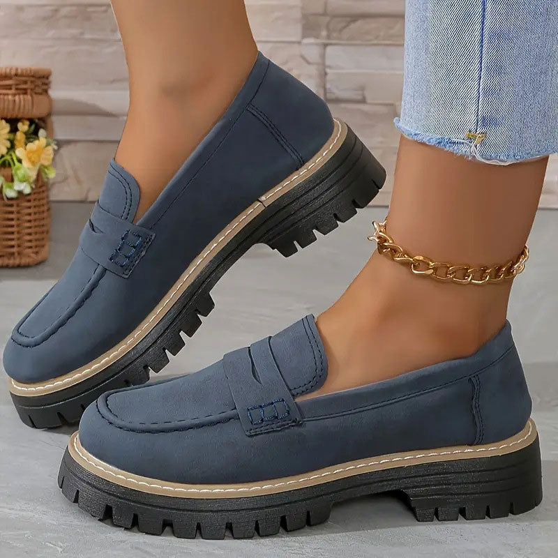 Elegant women's platform loafers, slip-on style with a chic vamp strap & chunky sole for comfort.