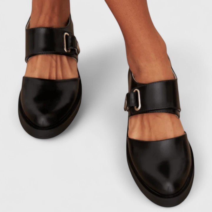 Black platform Mary Jane shoes for women with a trendy chunky sole, wide strap, and classic rounded toe.