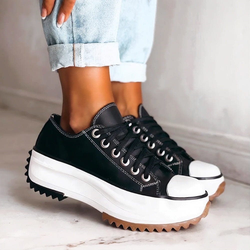 Women's black platform trainers with chunky sole & lace-up design for orthopedic comfort & everyday style.