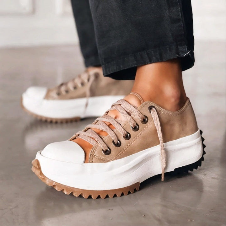 Trendy women's white chunky sole platform trainers, lace-up for casual style & comfortable walking shoes.