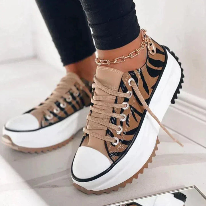 Women's black lace-up chunky sole platform trainers, ideal for casual everyday style & comfort.