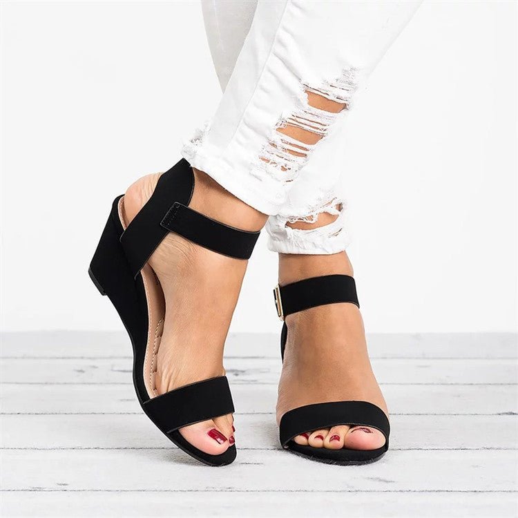 Women's black wedge ankle strap sandals, perfect for all-day comfort & versatile summer style. Open toe design.