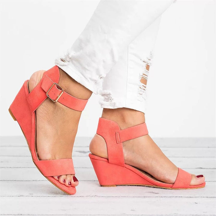Stylish women's wedge sandals with secure ankle strap & open toe for versatile day-to-night comfort. Summer essential.