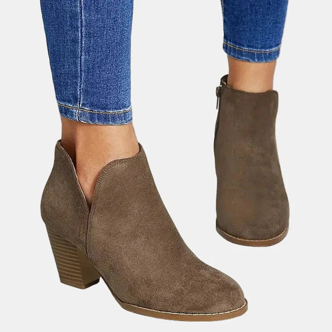 Comfortable women's round toe block-heel ankle booties with side zip, ideal for casual everyday wear.