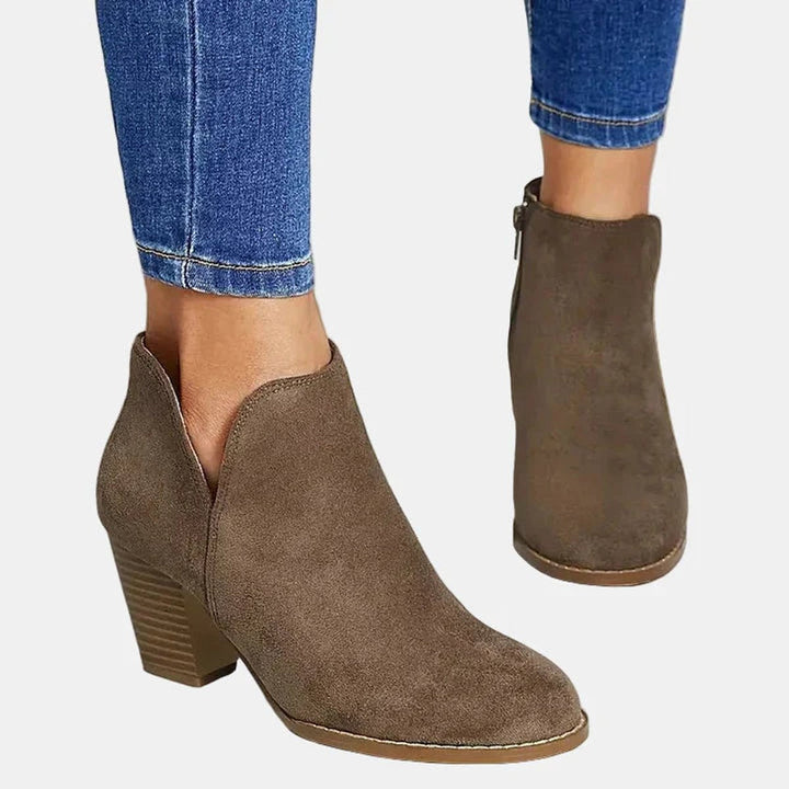 Comfortable women's round toe block-heel ankle booties with side zip, ideal for casual everyday wear.