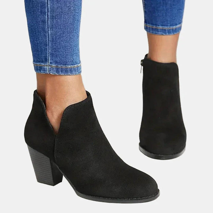 Versatile women's ankle boots with a sturdy block heel and side zip, excellent for casual or elegant looks.