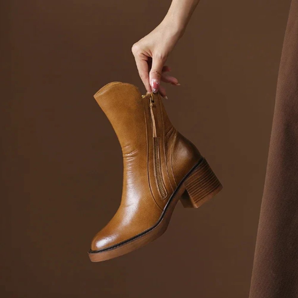Versatile women's block-heel ankle boots with convenient side zip, ideal for casual or dressy outfits.