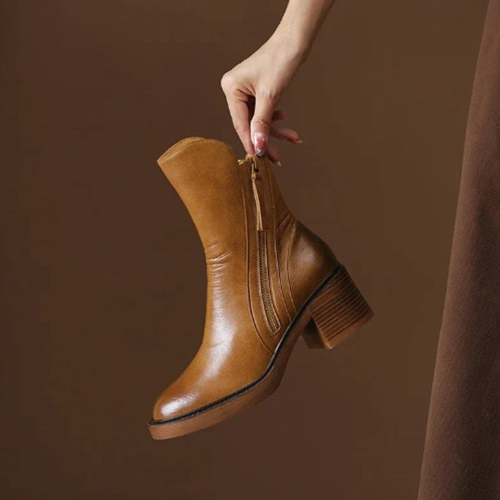 Versatile women's block-heel ankle boots with convenient side zip, ideal for casual or dressy outfits.