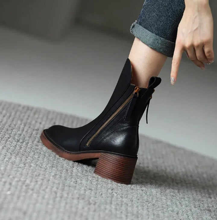 Women's block-heel ankle boots, classic design with side-zip closure for easy wear. Essential winter footwear.
